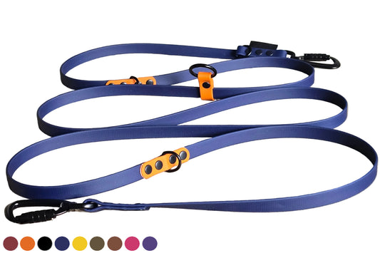 A detailed photograph of a Doggoz hands-free BioThane dog leash in Blue Night Sky color, features distinctive orange accents for the ringslipset and  D-rings and O-ring, and uses black carabiners. The durable, coiling leash is displayed on a clean white background. and a row of customizable color swatches.