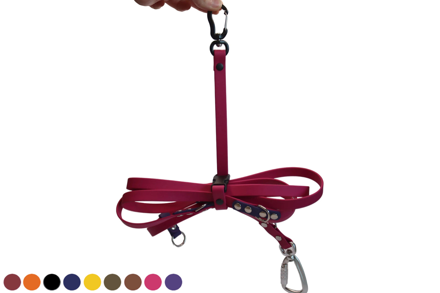 A pink BioThane Long Line Keeper from DoggoZ securing a matching pink long training lead. The keeper features a black quick-release buckle and a black carabiner for convenient hanging. Showing a choice of multiple colors: wine red, orange, black, navy blue, sunflower yellow, olive green, brown, magenta pink, purple